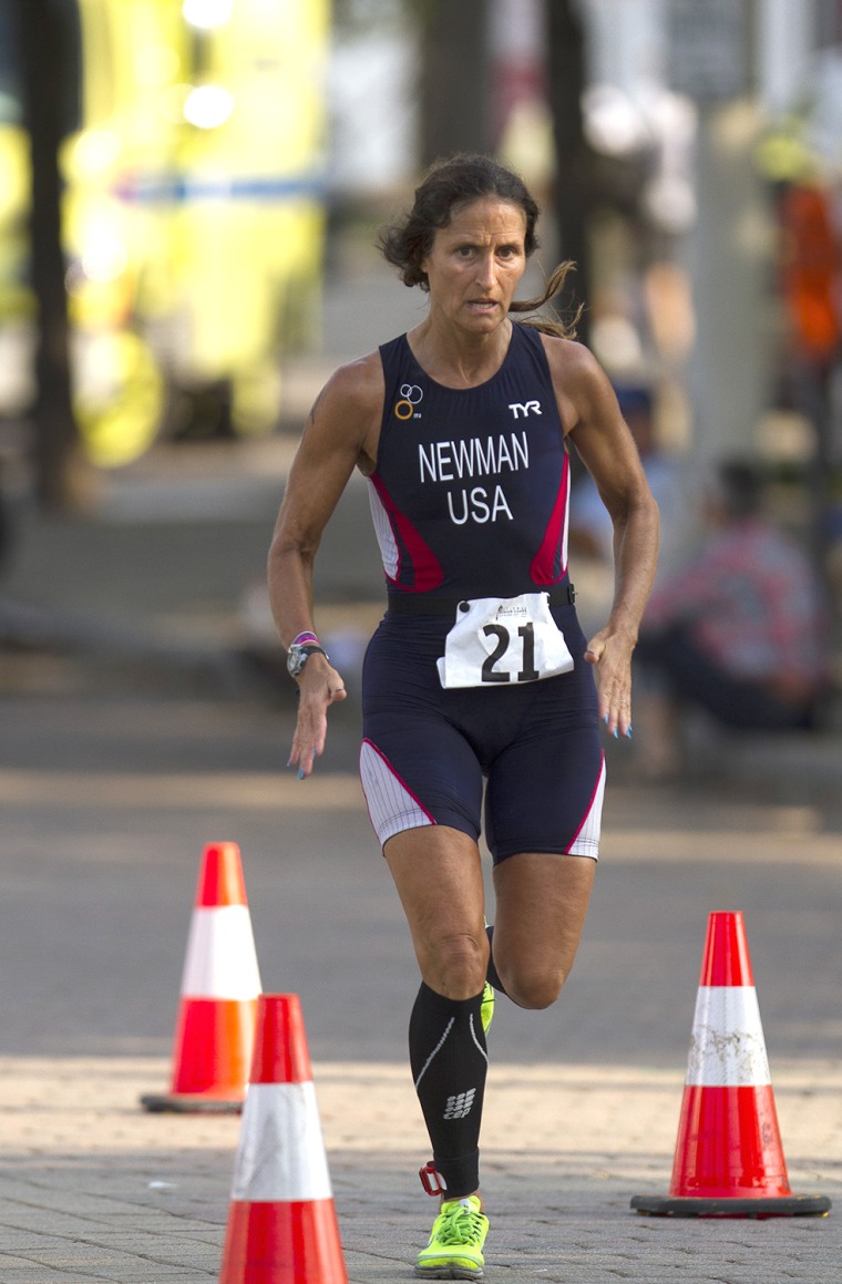 52-year-old Karen Newman from Conn. starts her third and final leg of the triathlon event on Sunday morning, July 21, 2013 at the 2013 National Senior Games in Cleveland, Ohio. Newman, who won the  women's gold medal at the event, is a breast cancer survivor and Team USA triathlete. (Â© Makenzie L. Goodman 2013/ Brooks Institute)